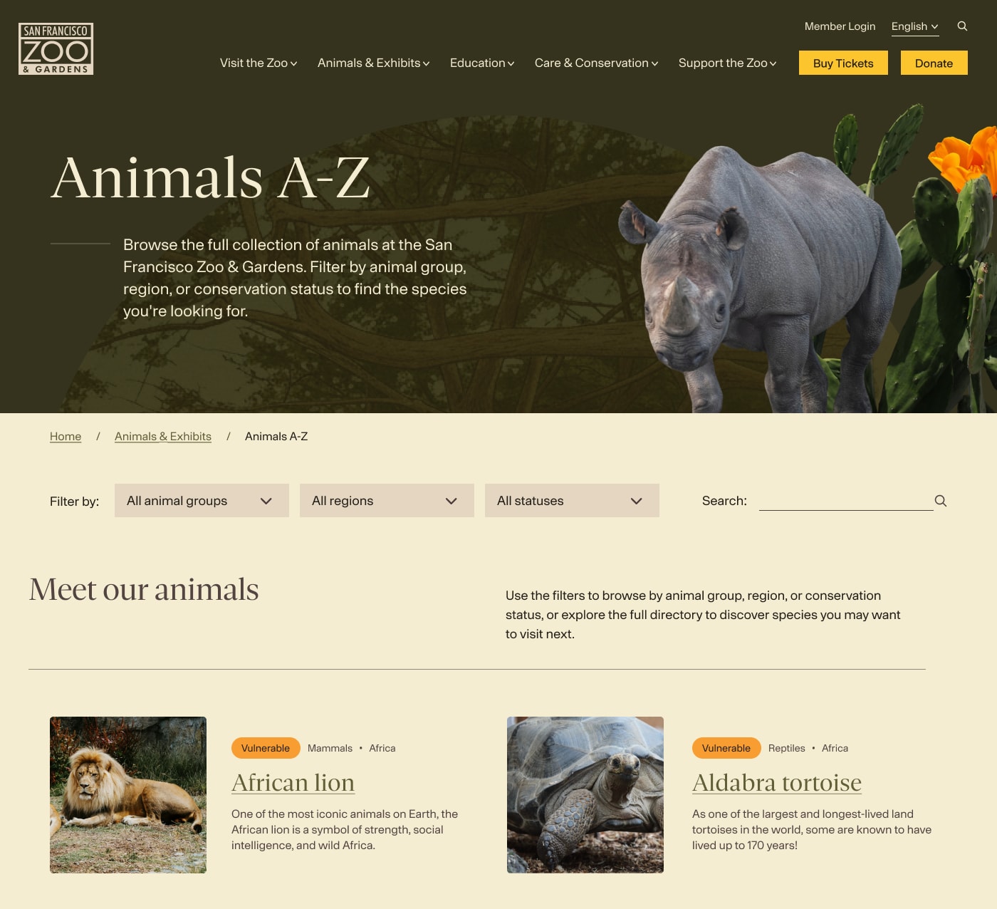 Animals A-Z page with filters for animal group, region, and conservation status, and cards for the African lion and Aldabra tortoise