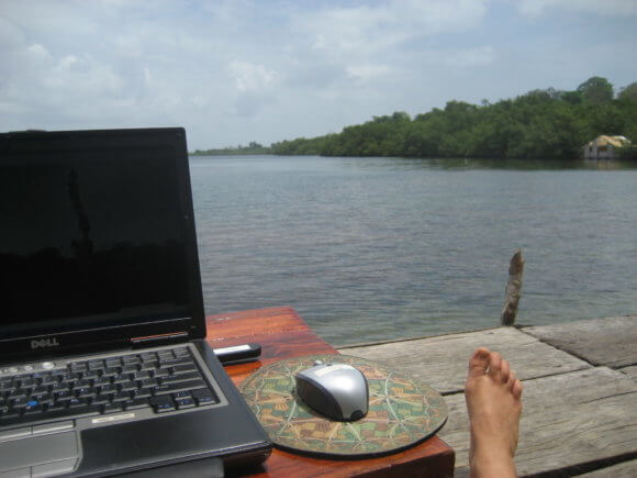 laptop by the lake working remotely