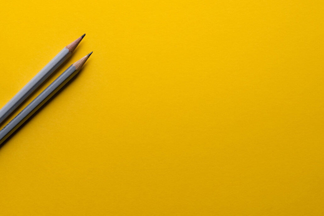 grey-pencils-yellow-background-illustrate-content-strategy