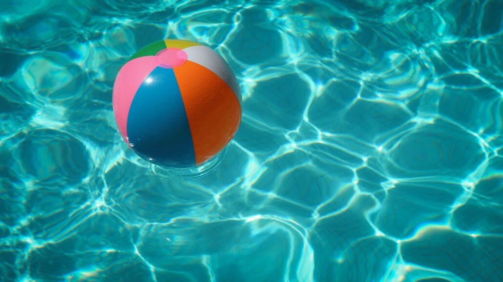 a beach ball floating on the pool