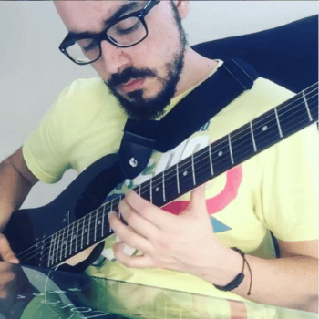 Aykan playing guitar