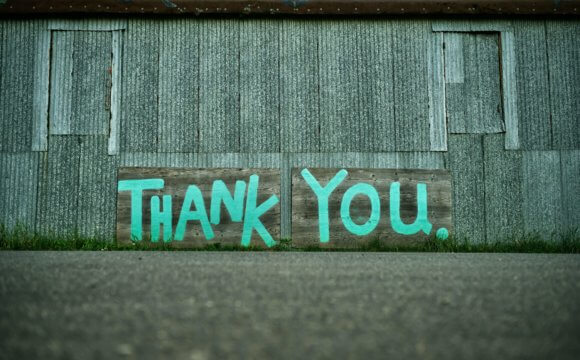 Thank You spraypainted on industrial wall