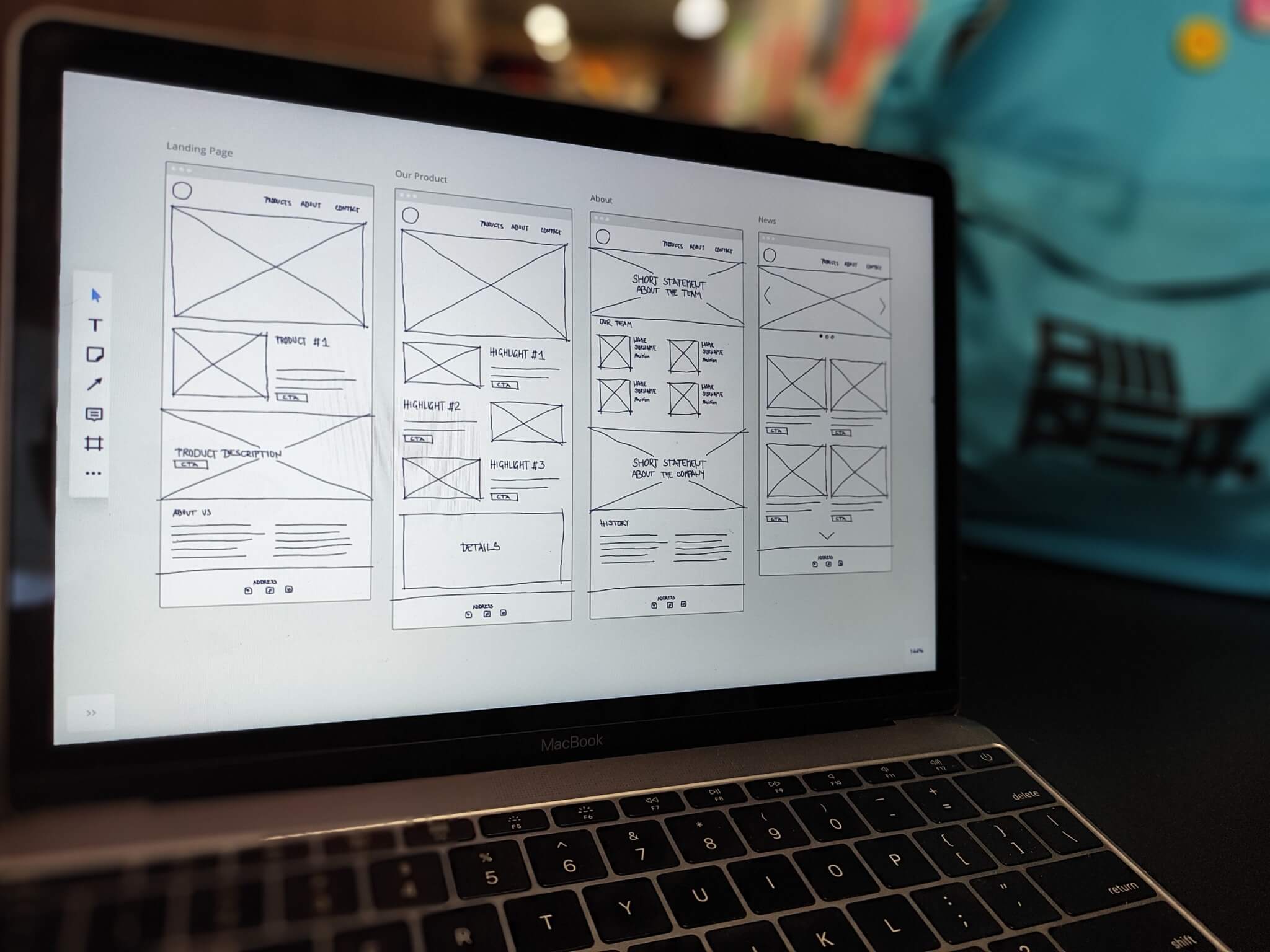 Laptop screen with UX sketches in black and white